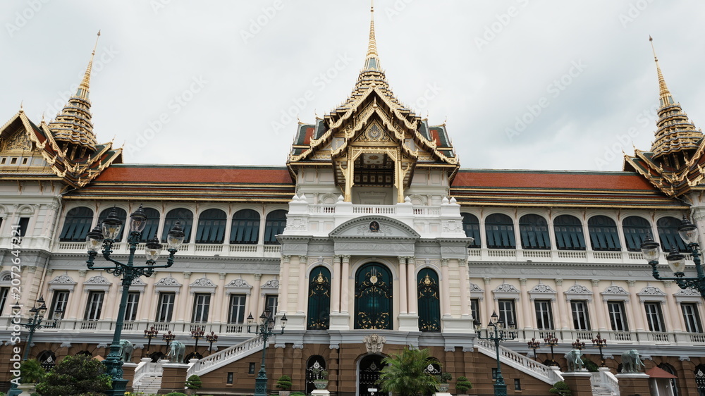 Fototapeta premium Symmetric Front Facade Grand Palace European Hall Mixed Thai Gilded Spire Architecture