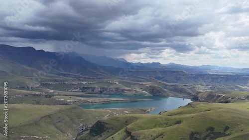 Aerial View South Africa Reservoir Under Brewing Storm Clouds Dramatic Overcast Sky Rolling Mountain Ridges