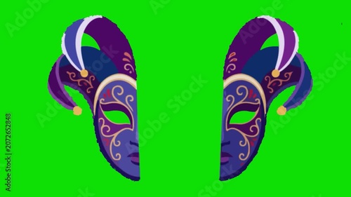 Two purple Mardi Gras masks with feathers and swirls on green. Festival d'Avignon in Avignon.