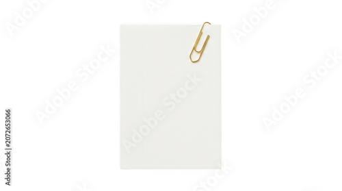 Blank white paper sheet with a gold paperclip attached isolated on transparent background
