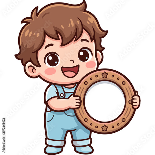 A cheerful boy excitedly holds a decorated wooden ring on white background