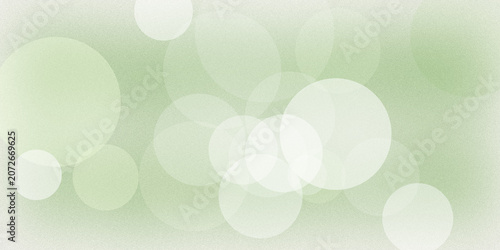 фотографія Soft light green background with grainy texture and defocused white circular bokeh elements for gentle natural clean design