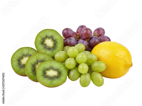 Fresh kiwi slices and whole grapes with a lemon during bright studio lighting isolated on transparent background
