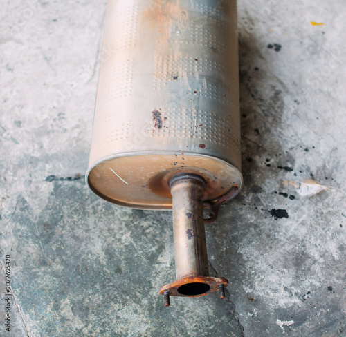 The car's exhaust pipe was placed on the cement floor.