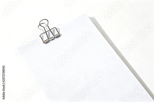 Minimalist Notepad with Metal Clip on White Background