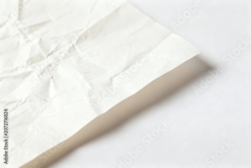 Close-up of Crumpled White Paper on Light Background