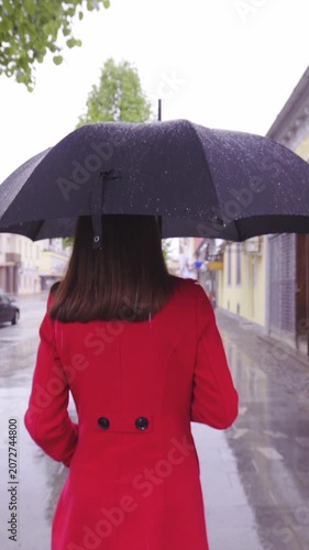 Woman walk in the rain