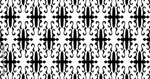 Elegant black and white seamless ornamental pattern with symmetrical decorative motifs. Repeating vector background suitable for wallpaper, textiles, and surface design.