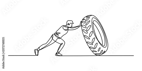 Foto Strong athlete man pushing a heavy rubber tire for workout training in a continu