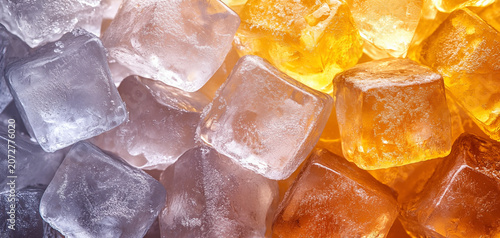 Close-up of translucent ice cubes in gradient shades of white, glowing orange and orange stacked together with visible frost textures, crystal clear frozen surfaces