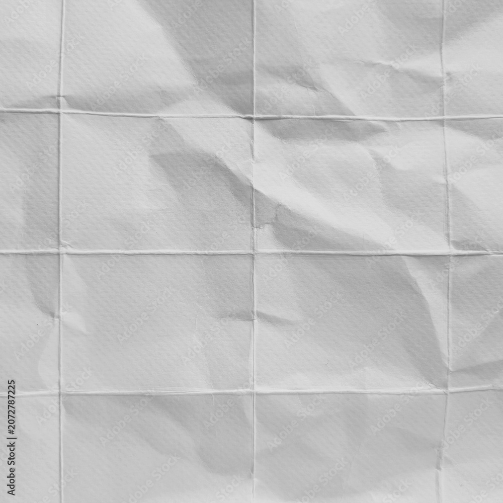 Fototapeta premium Crumpled grid paper texture background in grayscale
