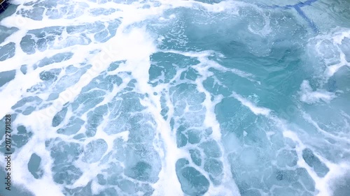 Frothy bubbles on water in circular hot tub