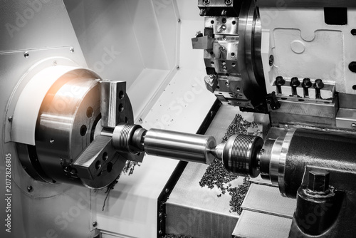 Tableau sur toile Metal rod spins precisely between lathe chuck jaws