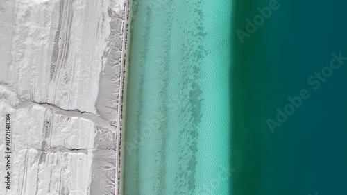 An aerial view of Lake Salda’s enchanting white sandy beach and turquoise waters. A unique natural landscape reminiscent of the Maldives.