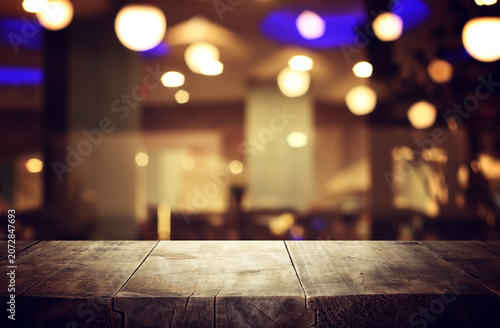 table and lights background during night time. Product display or mock up