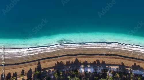 The turquoise waters of Lake Salda, its white shoreline, and the magnificent, symmetrical view from the air of the tree-lined shadows along the lakeside road.