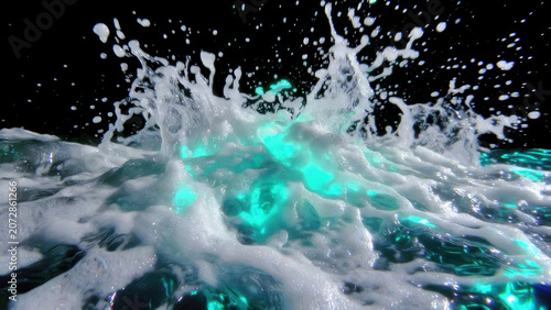 Black background overlay luminous sea foam splashing with teal light creating energetic abstract motion and wet texture in dramatic close up