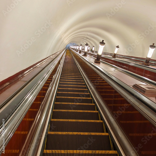 Subway escalator. A moving staircase for ascending or descending with an electric drive.
