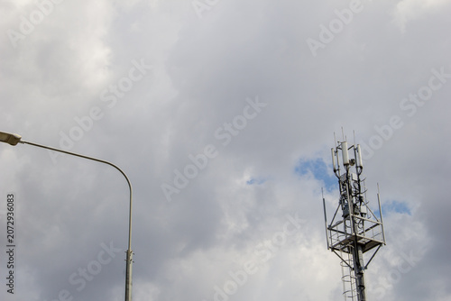 Telecommunication tower with cloudy sky background, Technology and communication concept.