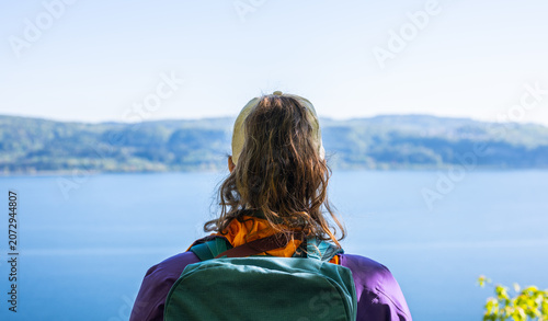 Quadro su tela Woman hiking enjoying scenic view lake constance