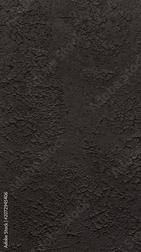Dark grunge wall texture. Rough black surface background. Abstract rugged dark gray concrete or stucco pattern with uneven cracks and bumps