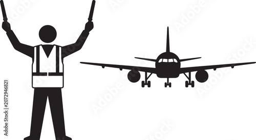 Airport ground crew marshaller with signal wands guiding an airplane