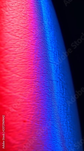 Macro skin texture under vivid red and blue light, dermatology, therapy, beauty, abstract technology