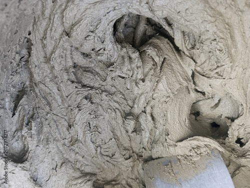 Фотография Fresh cement based mortar mix with performance additives and plasticizers for du