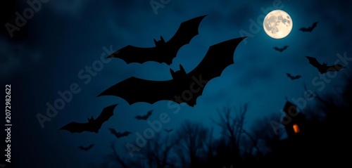 Spooky Halloween bat silhouettes against a moonlit night sky, moon, festive