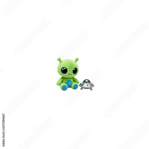A cute green plush alien toy sitting next to a small metallic flying saucer on a white background.