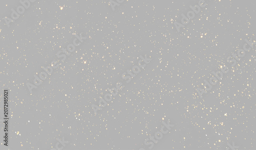 Fotografie Golden glitter particles on gray  background, glowing sparkle dust split screen