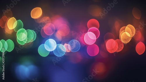 Colorful bokeh lights with soft glow in dark background
