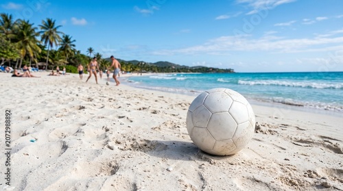 Soccer ball on a tropical beach, combining sports, leisure, and outdoor adventure.