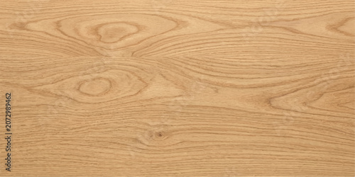 Foto A close-up shot showcases the intricate grain pattern and natural texture of a polished wooden surface, highlighting its organic beauty and warmth