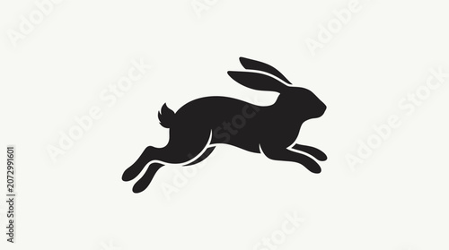 Silhouette of a rabbit jumping and running fast.