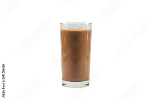 A tall clear glass filled with creamy chocolate milk, isolated on a white background, showing smooth texture and rich brown liquid color