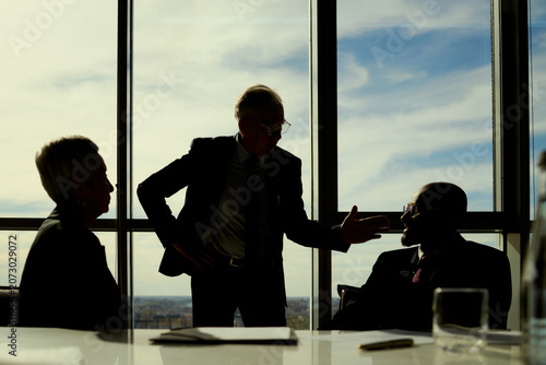 Fotografie Wide shot of senior businessman leading oil industry meeting with colleagues, discussing strategy and partnership decisions