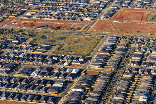 Weir Views aerial view of residential housing and suburban streets and new developments, Victoria Australia