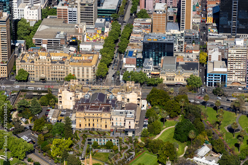 Fototapeta premium Melbourne aerial view of Victorian Parliament House and Treasury Gardens near Spring Street, Victoria Australia