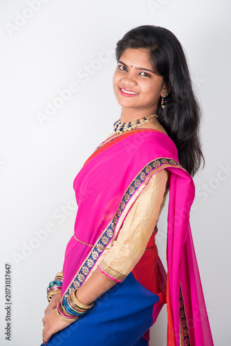 Fotografie Happy young beautiful Indian woman in saree.