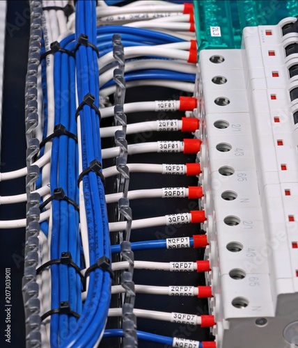 Marking electrical wiring wires with thermally printed nylon tape. 