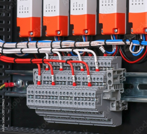 Marking electrical wiring wires with thermally printed nylon tape. 