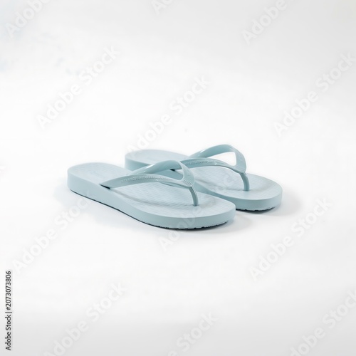 Pair of Simple Light Blue Rubber Flip Flops Isolated on White Background.