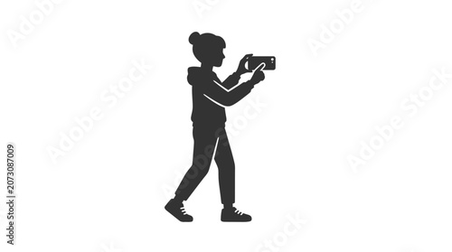 Photographer captures a digital image using a handheld camera while walking outdoors.