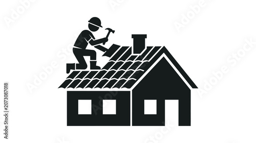 Roofer repairs a residential house roof with a hammer while kneeling on the shingles.