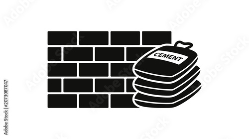 Cement bags are stacked neatly beside a newly constructed brick wall on a building site.