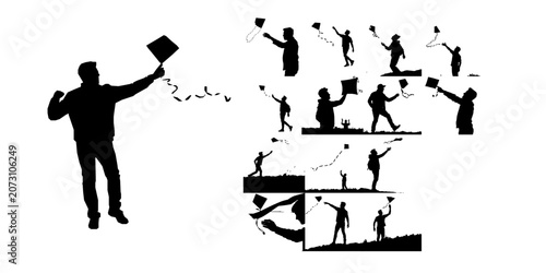 фотографія Man Releasing A Paper Kite In The Wind Silhouette