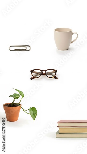 Minimalist Vertical Flat Lay of Office and Lifestyle Objects on White Background.
