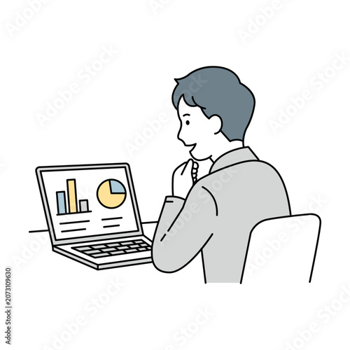 ノートパソコンのグラフ画面を熱心に見て分析する会社員
