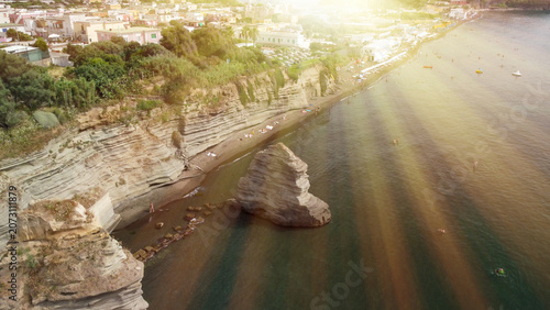 Fotografie High altitude aerial shot of Faraglioni rocks near Procida coastline
